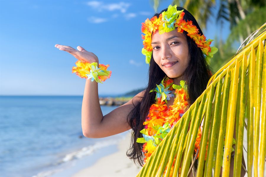 Woman in a flower crown on a beach
